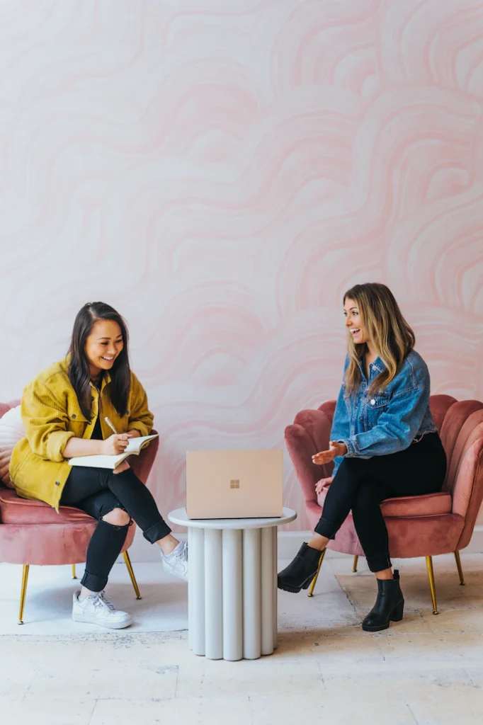 An image of two employees sitting together.