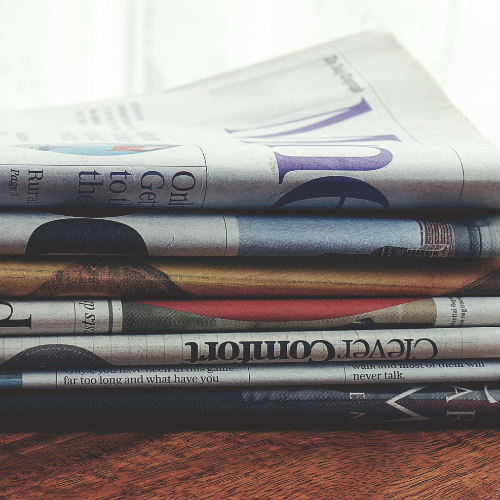 An image of a stack of newspapers.