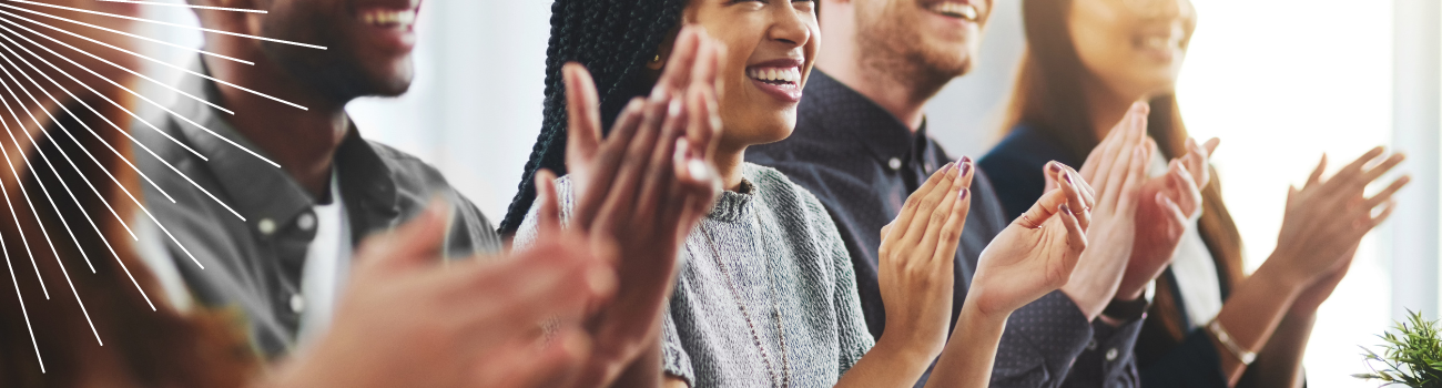 An image of people clapping