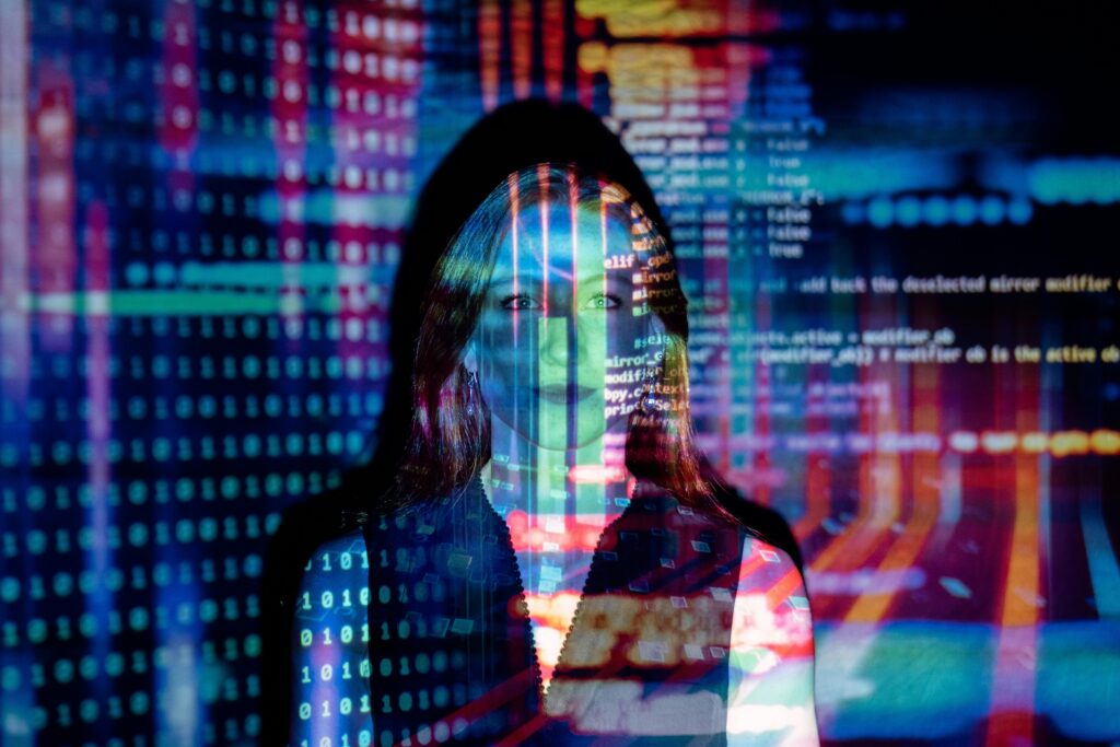 An image of a person in front of a projected image of data 